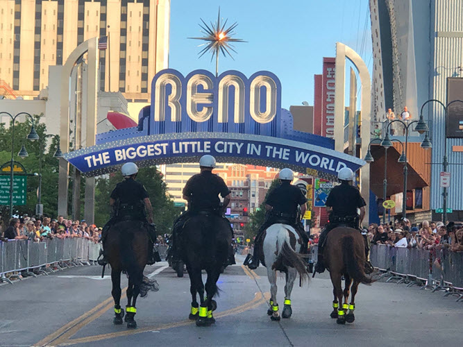 Officers and horses under arch