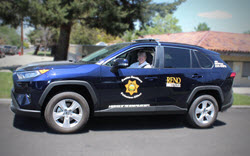 volunteer in S.A.V.E. patrol car